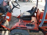 a tractor that is parked in a lot