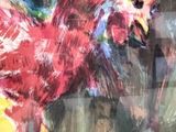 a painting of a rooster on display in a museum