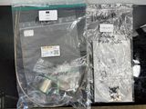 two bags of sewing supplies sitting on a shelf
