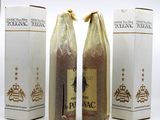 three bottles of wine sitting next to each other on top of a table