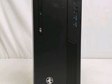 a black desktop computer sitting on top of a white table