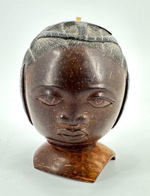 an image of a wooden sculpture of a woman ' s head