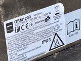 a sticker on the side of a dumpster that has a warning sign on it