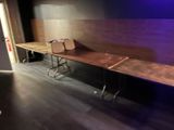 a long table with a bag on it in a room