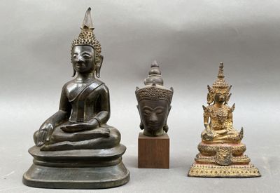 three statues of buddhas sitting next to each other
