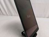 a tablet that is sitting on a stand on a table