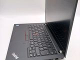 a laptop with a black keyboard sitting on a white surface