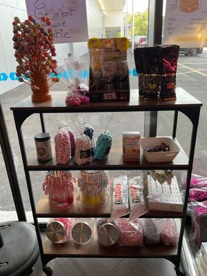 a cart that has various items on it in front of a store