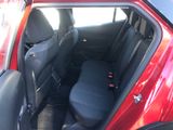 a red car with black seats in the back of it