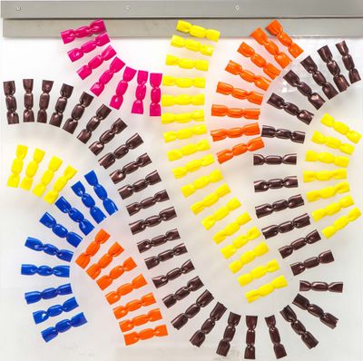 a lot of different colored clips on a white surface