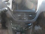 a picture of a car dashboard with a cup of coffee in it