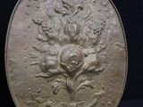 a picture of a silver plate with a flower design on it