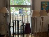 three lamps that are on the floor in the room