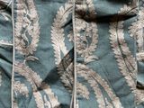 a close up of a blanket with a pocket on top of it