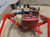 an image of a gas powered lawn mower in a garage