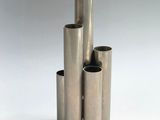 three stainless steel tubes stacked on top of each other