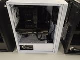 a white computer case sitting on a table in a room