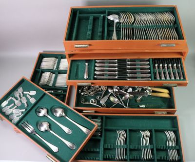 many different types of silverware in a wooden box