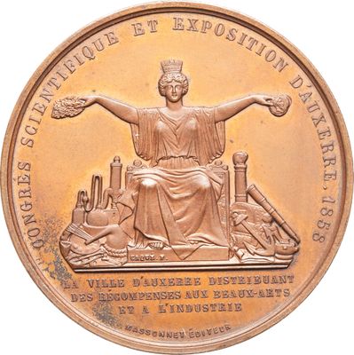 une image représentant une pièce de monnaie en bronze sur laquelle figure une statue
