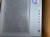 a computer in a box with a mouse on top of it