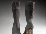louis vuitti boots with a wooden block heel in the middle of them