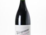 a bottle of wine that is sitting on a table