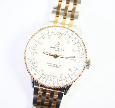 an image of a close up of a wrist watch on a white surface
