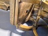 a close up of a gold clock on a table
