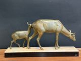 bronze sculpture of a mother and baby deer on a wooden base