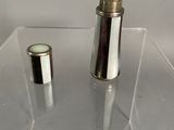 a glass table with a lighter on it and a lighter in the middle