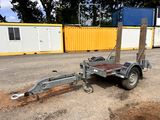 a trailer with a trailer attached to it in a parking lot