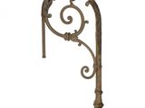 a close up of a decorative iron bracket on a white background