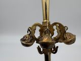 an image of a brass candle holder on a white background