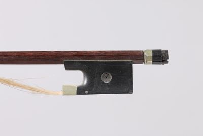 a close up of a violin bow on a white background