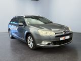 the grey citrole is parked in a room with a black floor