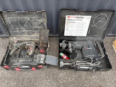 two tools in a case sitting on the ground