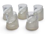 four clear glass cups sitting on top of each other on a white surface