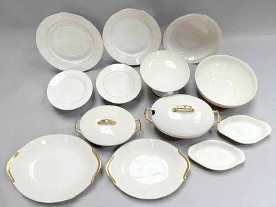an image of a group of white and gold plates and bowls