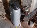 an image of a dirty room with a trash can in it