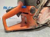 a chainsaw that is sitting on the floor