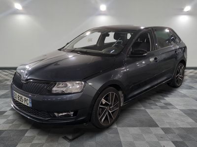 a picture of a dark colored car parked in a garage