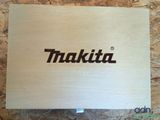 the makita box is made of wood and has a logo on it