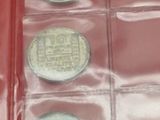 a red box with a lot of coins inside of it