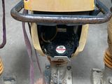 a yellow machine that is sitting on the ground