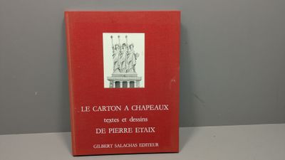 the book is sitting on a table with a red cover