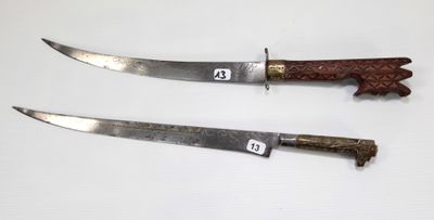 two knives that are sitting on a table
