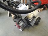 an image of a machine with a hose attached to it ' s side