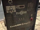 a close up of a welding machine on a table in a room