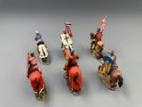 six figurines of knights on horseback with flags and spears