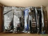 six packs of black and white condoms in a cardboard box